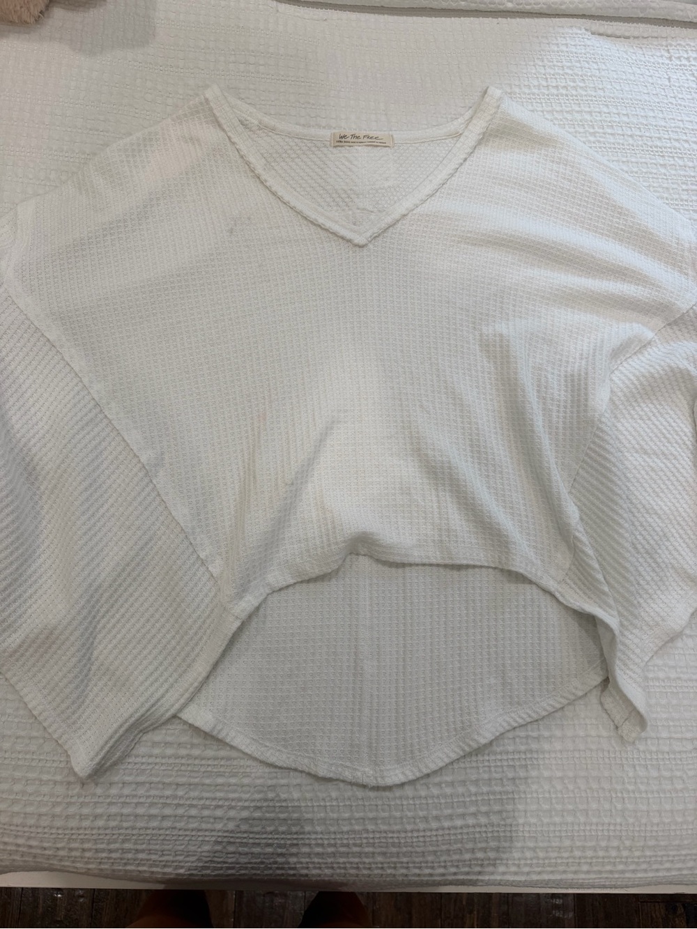 Free people we the free oversized white top!